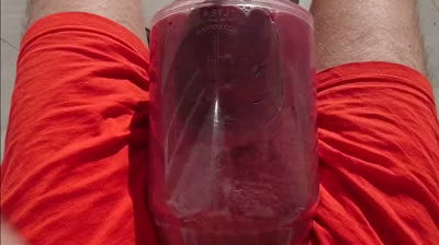 Giant balls pumping hunk outdoors