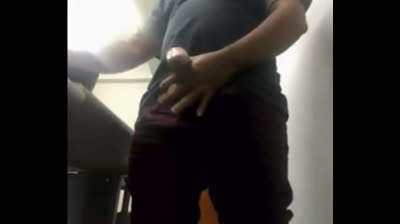 Brazilian Daddy Strokes His Big Uncut Cock at Work